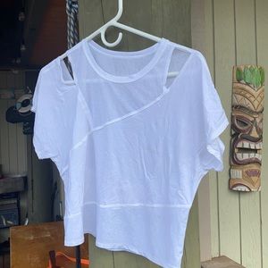 never worn, be cause I can't fit it over my chest, is a Cropped very cute top.